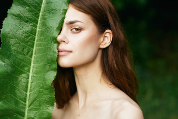 beautiful woman on green leaves park nature