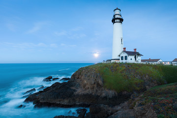 White pigeon point lighthouse with a blue sky  Historic Old Lighthouse at sunset - Pigeon Point...