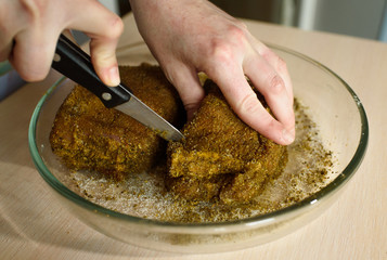 Female cook cooks delicious pastrami
