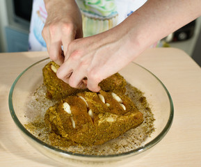 Female cook cooks delicious pastrami