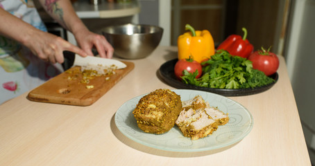 Girl cook cuts meat for a delicious tortilla
