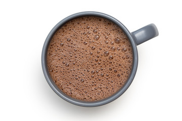 Hot chocolate in a blue-grey ceramic mug isolated on white from above.