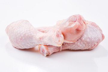 Tasty raw chicken legs. Top view. Isolated on white