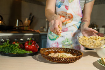 Girl cook cooks delicious tortilla pork and fresh vegetables