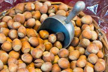Hazelnuts with scoop, for self-service in the organic market, healthy food.