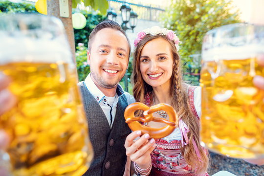Couple in Bavaria enjoying a beer in a traditional pub
