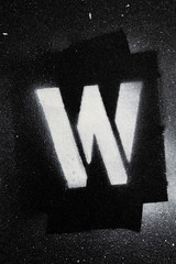 Letter W grunge spray paninted stencil font