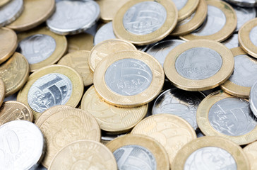Many scattered brazilian real coins money. Coins of savings. Brazil. Growing business and future concept, coins stack.