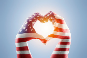 Two hands in the form of heart with Usa flag