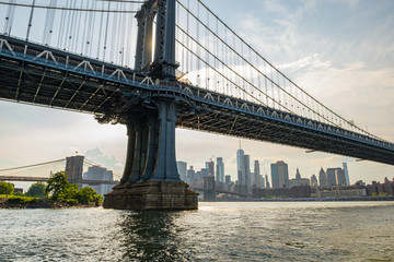 Manhattan Bridge and buildings on East river side view from Brooklyn