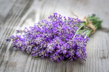 Bouquets of lavender on wooden background. Medicinal plants. Aromatherapy.