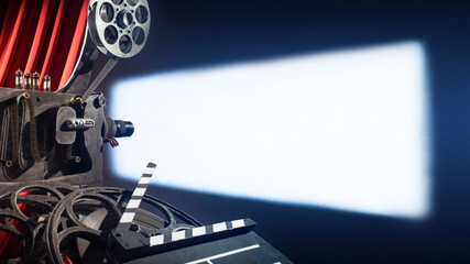 movie camera with film projects on the wall of the movie