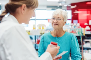 Printed roller blinds Pharmacy Senior woman in pharmacy talking to the chemist or pharmacist