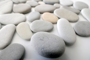 Fototapeta na wymiar Round Gray Stones isolated on a White Background