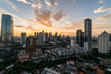 Fototapeta na wymiar Sunset over Jakarta business district in Indonesia