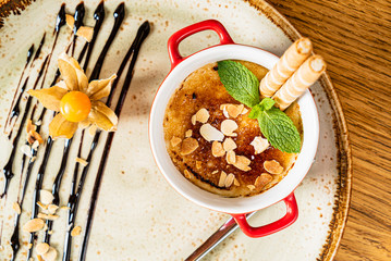 caramel dessert with waffle and physalis
