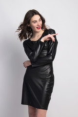 little black dress  beautiful fashion model posing isolated in studio