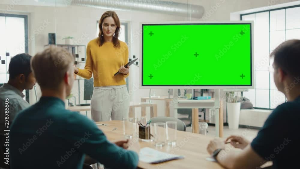 Poster female project manager holds meeting presentation for a team of developers. she shows green screen i