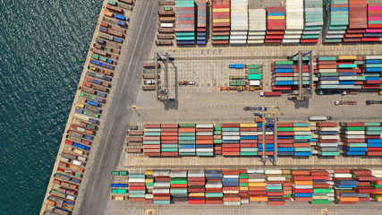 Aerial drone photo of industrial cargo area with cranes, container ships and logistics, Piraeus...