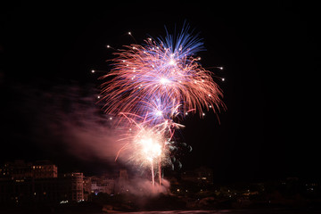 Firework celebrating Bastille Day in Biarritz city. Basque Country of France.