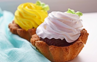 Delicious cakes basket of short pastry with jam and cream.