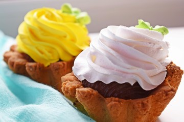 Delicious cakes basket of short pastry with jam and cream.