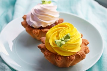 Delicious cakes basket of short pastry with jam and cream.