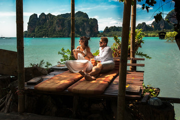 Happy couple on an island off the coast.  Young couple by the sea. Couple travels about the world....