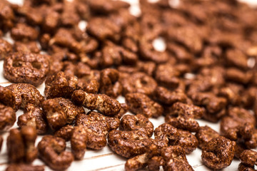 Dry cereal breakfast in the form of letters of the English alphabet on a white background.