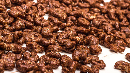 Dry cereal breakfast in the form of letters of the English alphabet on a white background.