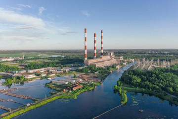 Naklejka premium Scenic aerial view of the largest thermal power plant in Europe. Beautiful summer sunny look of big electricity station in sunset light