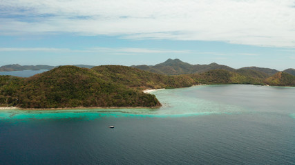 group tropical islands with white sand beach and blue clear water. aerial view seascape Philippines Palawan, Bulalacao