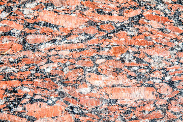 Polished red granite stone as background