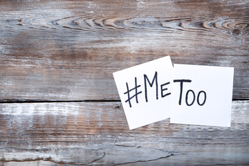 Paper with text Me Too on wooden table
