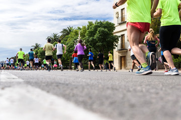 Valencia, Spain - May 19, 2019: Group of runners participating in a popular race.
