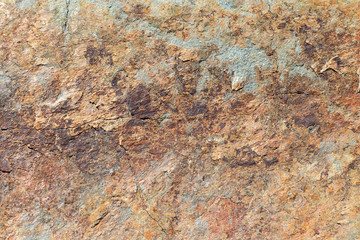 The surface of the marble with a brown tint. Stone gray background. This is a horizontal cement-concrete.