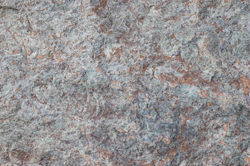 Gray stone background. The surface of the marble with a brown tint. This is a horizontal cement-concrete.