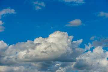 White cumulus clouds, blue sky. Good summer weather