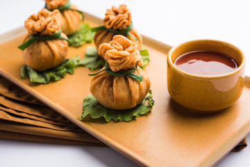 Crispy Potli Samosa or veg money bags are delicious Indian snacks of spiced aloo and mix veggies Or Meat/kheema  stuffed in flaky dough. It's a great creative starter or appetiser. served with ketchup