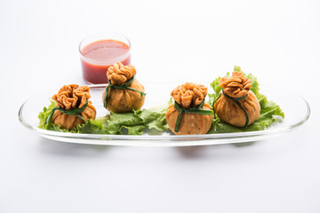 Crispy Potli Samosa or veg money bags are delicious Indian snacks of spiced aloo and mix veggies Or Meat/kheema  stuffed in flaky dough. It's a great creative starter or appetiser. served with ketchup