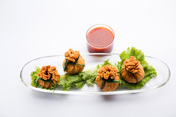 Crispy Potli Samosa or veg money bags are delicious Indian snacks of spiced aloo and mix veggies Or Meat/kheema  stuffed in flaky dough. It's a great creative starter or appetiser. served with ketchup