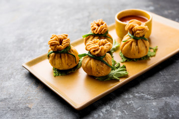 Crispy Potli Samosa or veg money bags are delicious Indian snacks of spiced aloo and mix veggies Or...