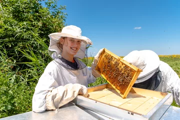 Fotobehang Young girl beekeeper © Jovan