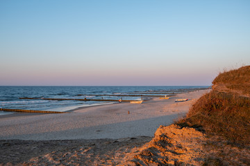 Fototapeta na wymiar The beach of Zempin on the island of Usedom in the Baltic Sea at sunset..