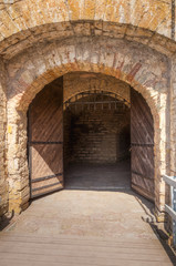 Fototapeta na wymiar Wooden gate in ancient medieval fortress Oreshek
