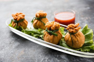 Crispy Potli Samosa or veg money bags are delicious Indian snacks of spiced aloo and mix veggies Or Meat/kheema  stuffed in flaky dough. It's a great creative starter or appetiser. served with ketchup