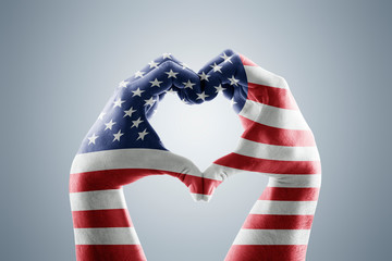 Two hands in the form of heart with Usa flag 