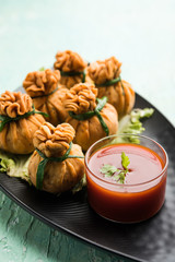 Crispy Potli Samosa or veg money bags are delicious Indian snacks of spiced aloo and mix veggies Or Meat/kheema  stuffed in flaky dough. It's a great creative starter or appetiser. served with ketchup