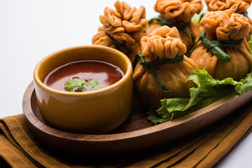 Crispy Potli Samosa or veg money bags are delicious Indian snacks of spiced aloo and mix veggies Or Meat/kheema  stuffed in flaky dough. It's a great creative starter or appetiser. served with ketchup