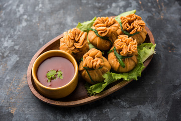 Crispy Potli Samosa or veg money bags are delicious Indian snacks of spiced aloo and mix veggies Or Meat/kheema  stuffed in flaky dough. It's a great creative starter or appetiser. served with ketchup